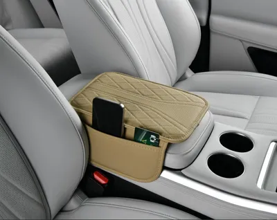 Funda de reposabrazos en forma de Y, color beige.